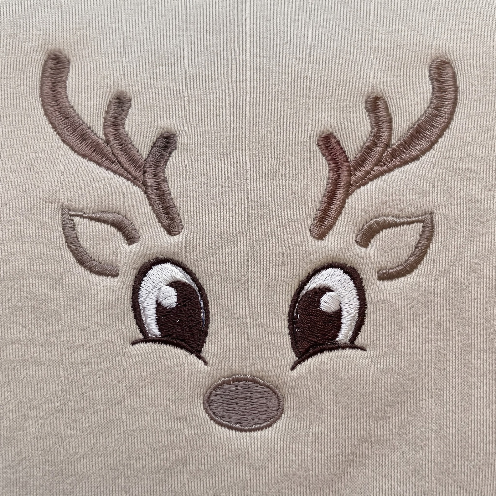 Personalized Cute Reindeer Face Antlers Big Eyes Minimalist Christmas embroidered sweatshirt — front view