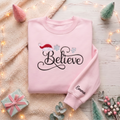 Personalized Believe Script Santa Hat Snowflakes Christmas embroidered sweatshirt — front view