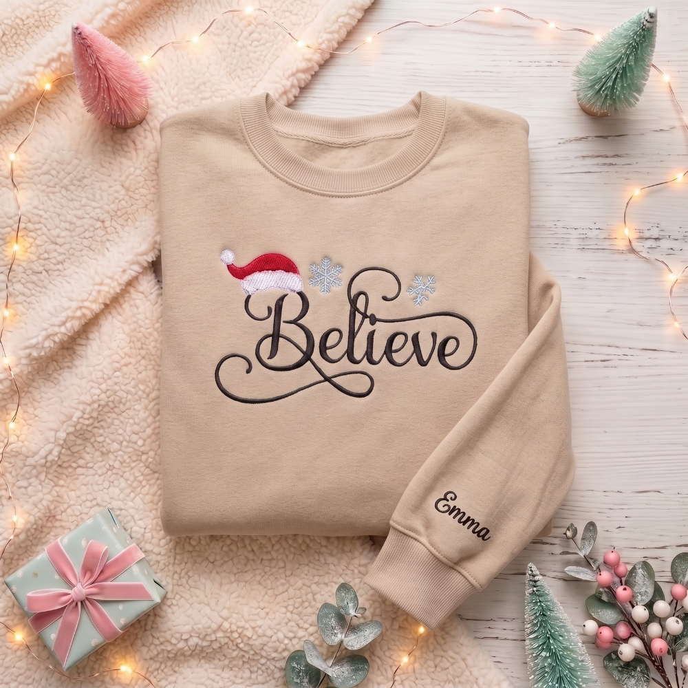 Personalized Believe Script Santa Hat Snowflakes Christmas embroidered sweatshirt — front view