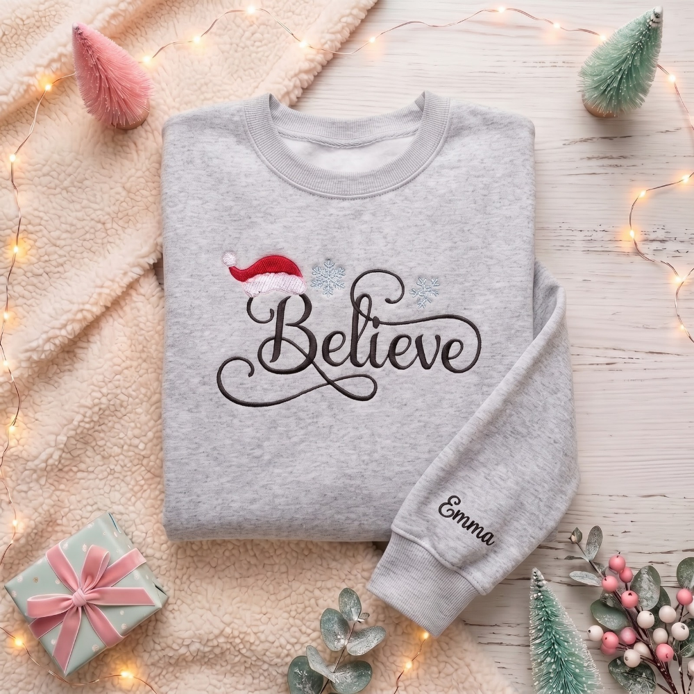 Personalized Believe Script Santa Hat Snowflakes Christmas embroidered sweatshirt — front view