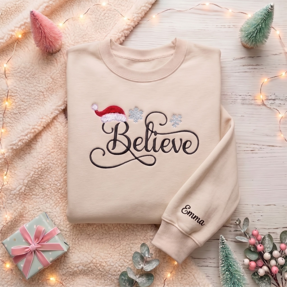 Personalized Believe Script Santa Hat Snowflakes Christmas embroidered sweatshirt — front view