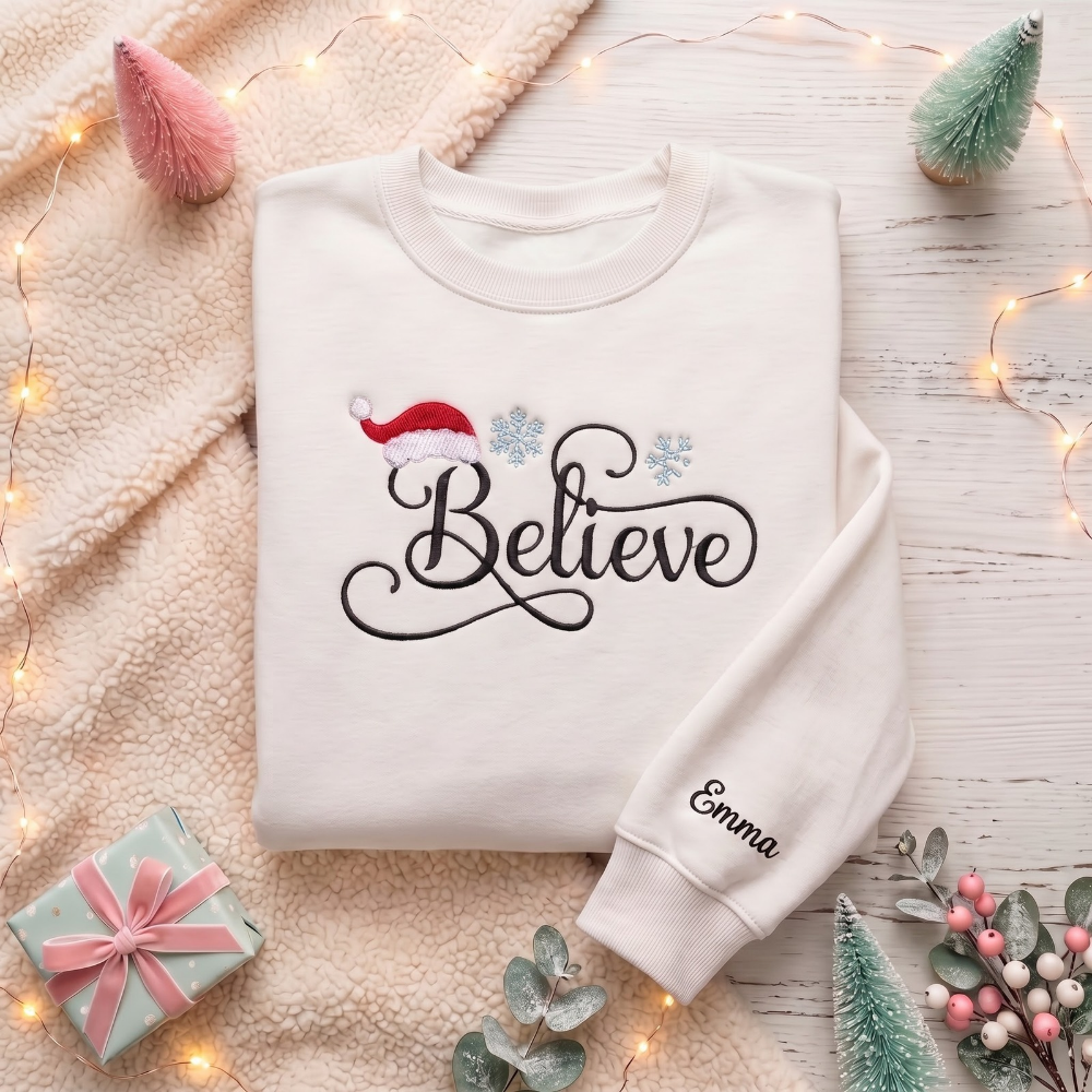 Personalized Believe Script Santa Hat Snowflakes Christmas embroidered sweatshirt — front view