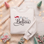 Personalized Believe Script Santa Hat Snowflakes Christmas embroidered sweatshirt — front view
