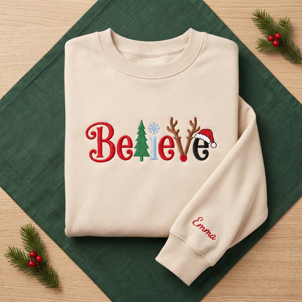 The Personalized Believe Christmas Tree Reindeer Antlers Santa Hat Embroidered Sweatshirt