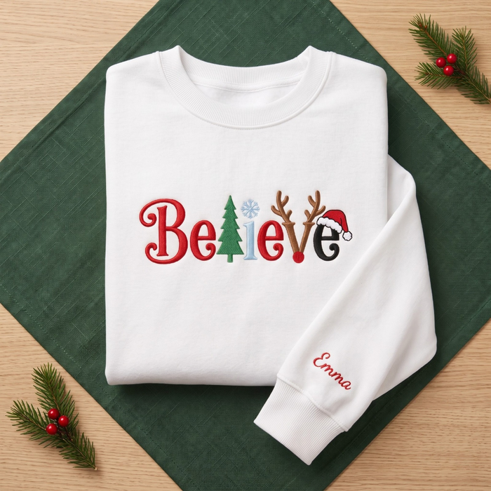 The Personalized Believe Christmas Tree Reindeer Antlers Santa Hat Embroidered Sweatshirt