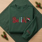The Personalized Believe Christmas Tree Reindeer Antlers Santa Hat Embroidered Sweatshirt