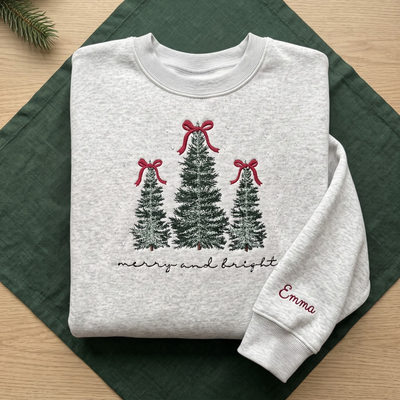The Personalized Merry And Bright Frosted Christmas Trees Red Bows embroidered sweatshirt — front view
