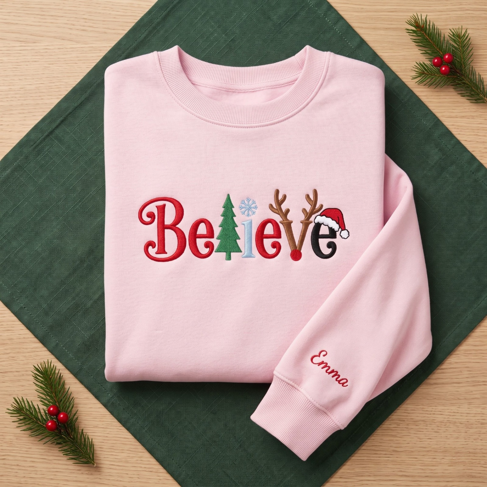 The Personalized Believe Christmas Tree Reindeer Antlers Santa Hat Embroidered Sweatshirt