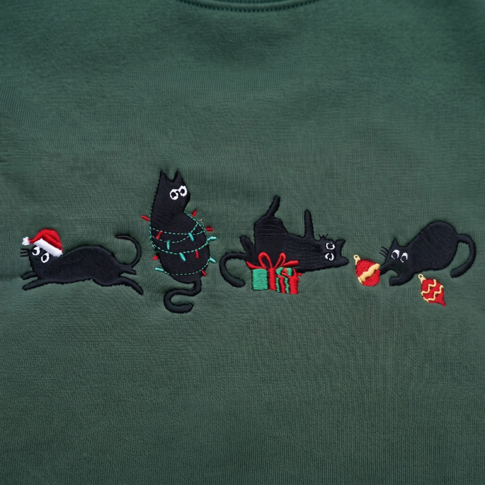 The Personalized Black Cats Christmas Mischief Santa Hat Tangled Lights Ornaments embroidered sweatshirt — front view