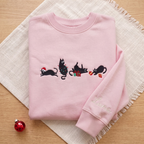 The Personalized Black Cats Christmas Mischief Santa Hat Tangled Lights Ornaments embroidered sweatshirt — front view