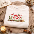 Toadstool Mushroom Cluster Fern Snail Berry embroidered sweatshirt — front view