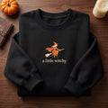 A Little Witchy Flying Witch Broomstick embroidered sweatshirt — front view