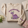 Auntiesaurus Purple Dino Daisy Crown Custom Name embroidered sweatshirt — front view