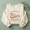 The Best Chapter Yet Grandma EST Year Custom Name Book Wildflower embroidered sweatshirt — front view