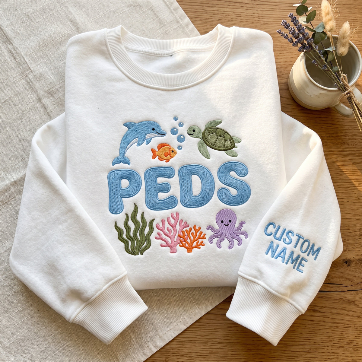 Personalized Peds Nurse Sea Animals embroidered sweatshirt — front view