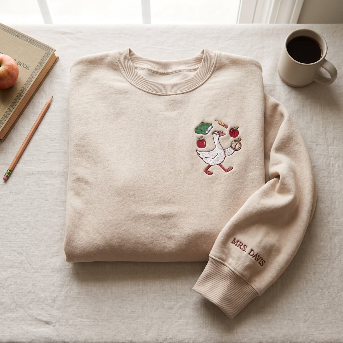 Personalized Teacher Goose Apples Books embroidered sweatshirt — front view
