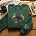 Personalized Raven Coffee Wildflower Wreath embroidered sweatshirt — front view