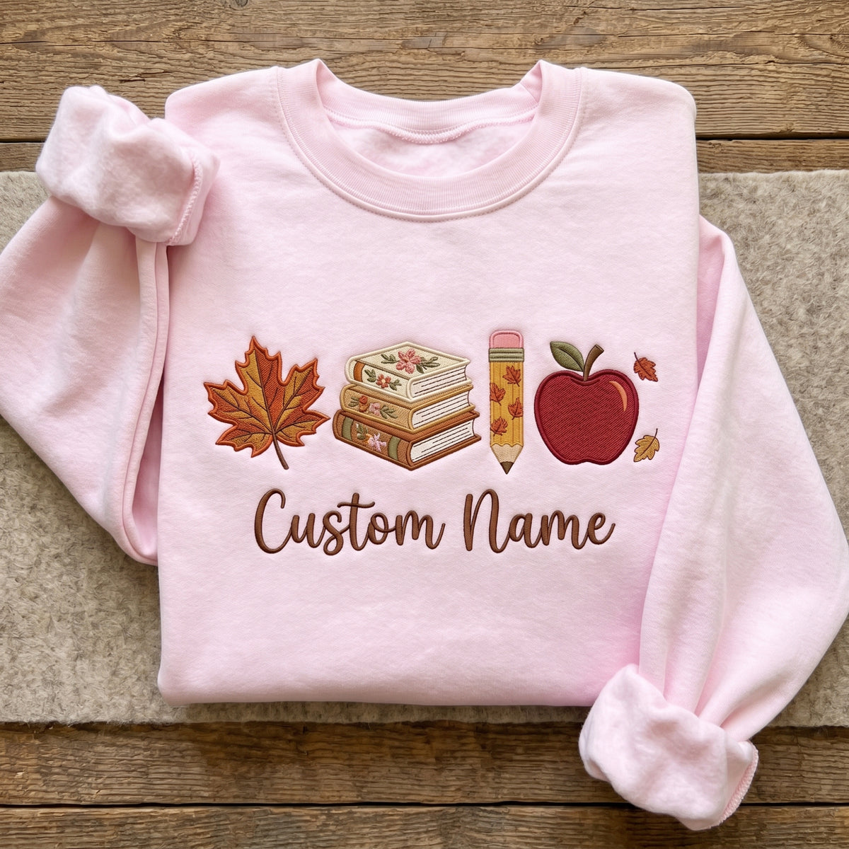 Personalized Teacher Name Fall Maple Leaf Books Pencil Apple embroidered sweatshirt — front view