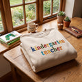 Kindergarten Teacher Colorful Letters embroidered sweatshirt — front view