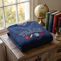 Teach Collegiate Apple Pencil Books Heart embroidered sweatshirt — front view