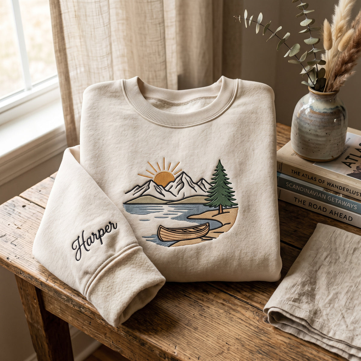Lake Canoe Sunrise Pine Mountain Scene embroidered sweatshirt — front view