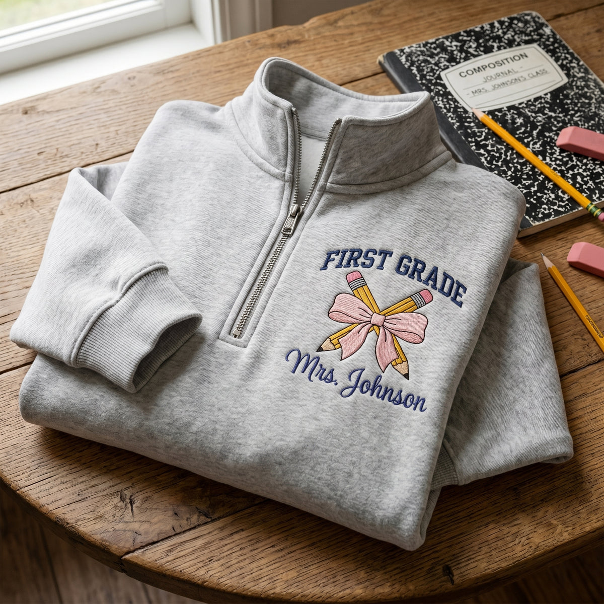 Personalized First Grade Teacher Pink Bow Crossed Pencils embroidered quarter-zip — front view