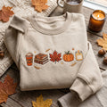 Fall Favorites Pumpkin Spice Latte Books Maple Leaf Pumpkin Candle embroidered sweatshirt — front view