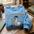 Personalized Teacher Goose Graduation Cap Pencil a Plus Notepad Lets Learn embroidered sweatshirt — front view