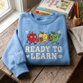 Personalized Teacher Walking Apple Characters Glasses Books Backpack Ready to Learn embroidered sweatshirt — front view