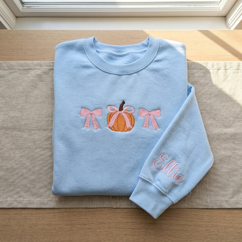 Personalized Fall Pumpkin Pink Coquette Bows Minimalist embroidered sweatshirt — front view