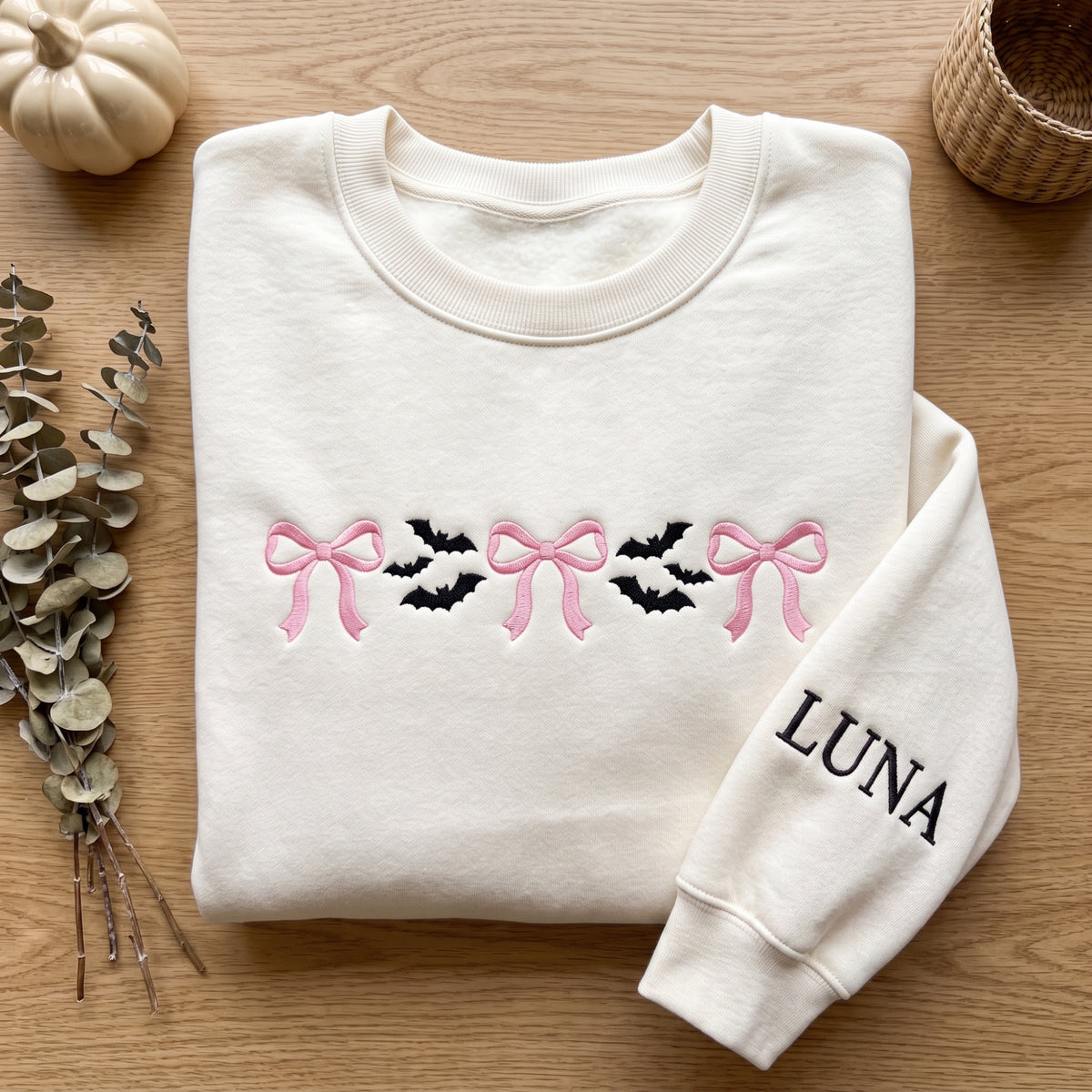 Personalized Halloween Pink Coquette Bows and Bats Minimalist embroidered sweatshirt — front view