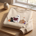 Ghost Reading Book Black Cat Candle Potion Book Stack embroidered sweatshirt — front view