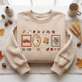 Personalized Autumn Harvest Goose Pumpkin Truck Watering Can Four Frames Floral Sleeve Name embroidered sweatshirt — front view