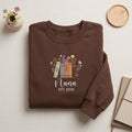 Personalized Nana EST Year Floral Books Wildflowers embroidered sweatshirt — front view