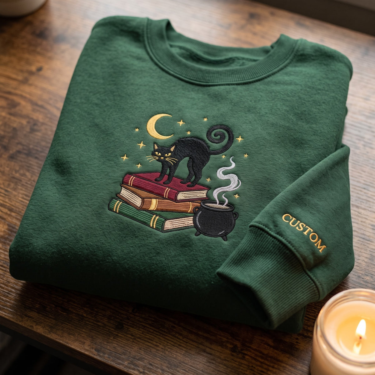 Personalized Halloween Black Cat Stacked Books Cauldron Crescent Moon Stars embroidered sweatshirt — front view