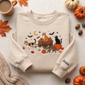 Personalized Halloween Cats Pumpkin Wagon Bats Moon Fall Leaves embroidered sweatshirt — front view