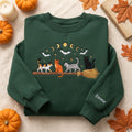 Personalized Halloween Four Cats Witch Broom Moon Phases Bats Stars embroidered sweatshirt — front view