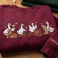 Personalized Christmas Geese Santa Workshop Toy Train Sleigh Checklist Funny Goose embroidered sweatshirt — front view