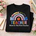 Teacher Mom Is the First Teacher Rainbow Apple School Supplies embroidered sweatshirt — front view