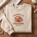 Personalized Promoted to Grandma EST Wildflower Bouquet embroidered sweatshirt — front view