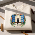 Cat Mom Home Black Cat Window Floral Wreath embroidered sweatshirt — front view