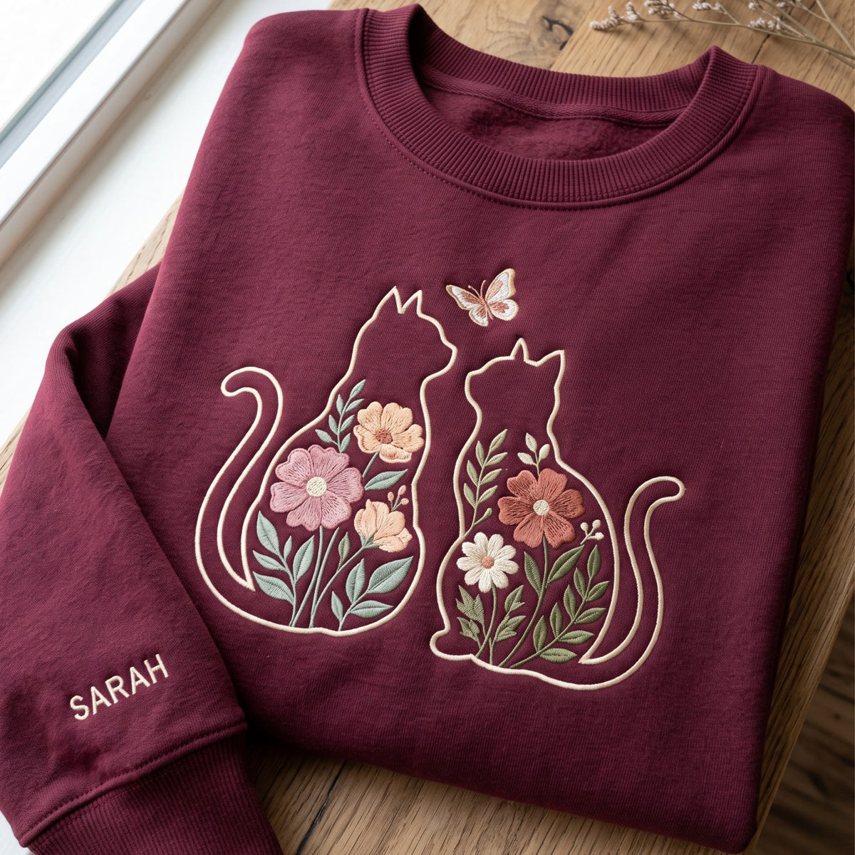 Personalized Two Cats Silhouette Wildflower Botanical Butterfly Sleeve Name embroidered sweatshirt — front view