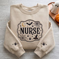 Halloween Nurse Witch Hat Spider Web Moon Crescent Victorian Badge Sleeve Spiders embroidered sweatshirt — front view