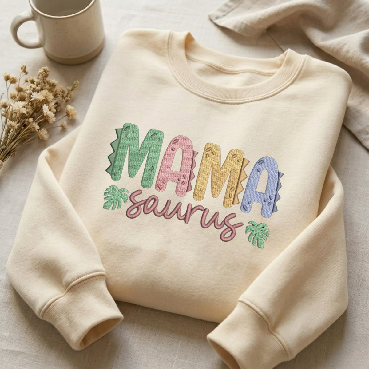 Mama Saurus Dinosaur Letters Tropical Leaves embroidered sweatshirt — front view