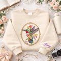 Personalized Hummingbird Floral Oval Frame Wildflower Botanical embroidered sweatshirt — front view