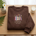 Personalized Nana EST 2026 Wildflower Books embroidered sweatshirt — front view