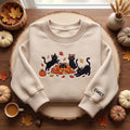 Personalized Autumn Black Cats Playing Leaf Pile Pumpkin embroidered sweatshirt — front view