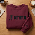 Personalized Mommy Old English Font Kids Names on Sleeve embroidered sweatshirt — front view