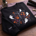 Personalized Halloween Floral Rib Cage Skeleton Ghosts embroidered sweatshirt — front view