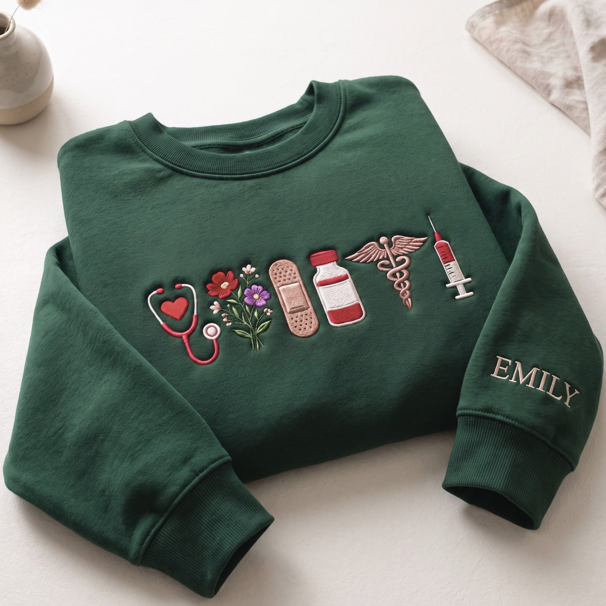 Personalized Nurse Stethoscope Wildflowers Bandage Medicine Bottle Caduceus Syringe embroidered sweatshirt — front view